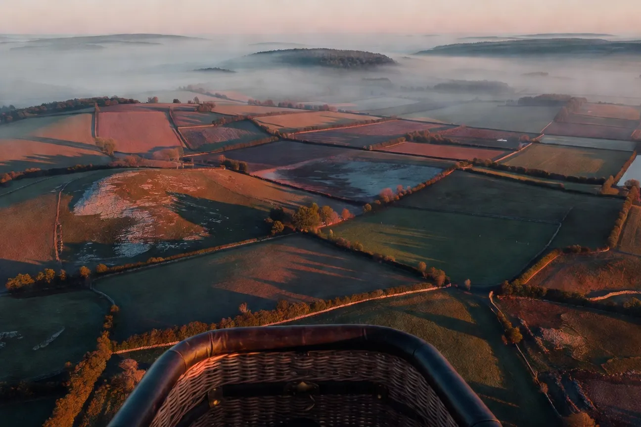 View from the balloon basket over farmland and forest in the Ottawa Valley